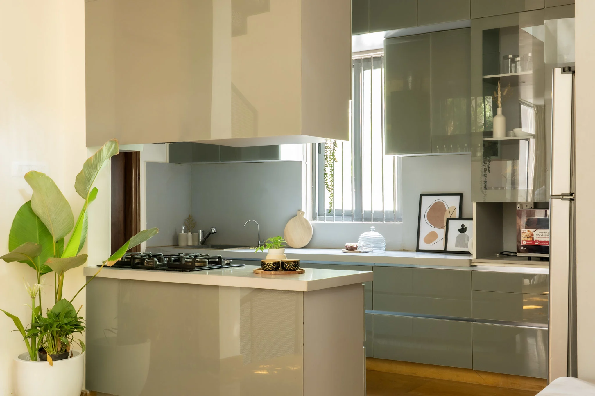 Modern modular kitchen with grey cabinets, island counter and natural ventilation