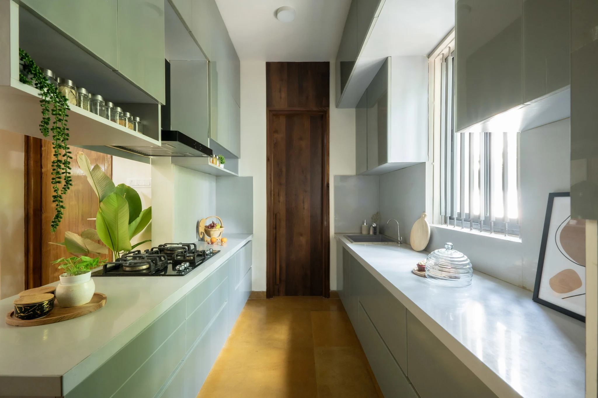 Parallel modular kitchen design with grey cabinets and long countertop layout