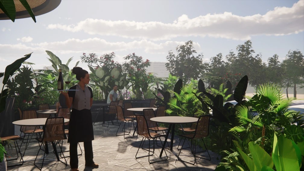 Outdoor restaurant seating surrounded by tropical landscape design and greenery