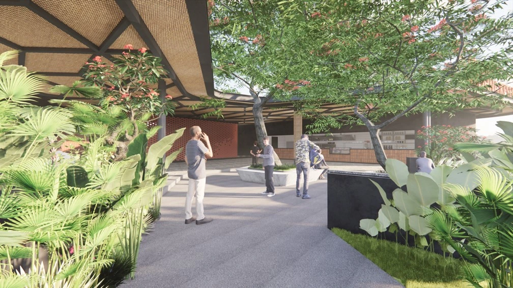 Outdoor restaurant landscape design with tropical plants and shaded gathering spaces in Bangalore